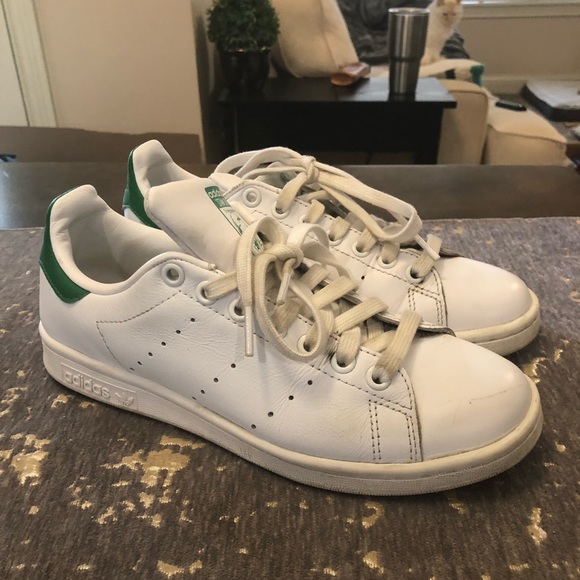 white adidas with green back